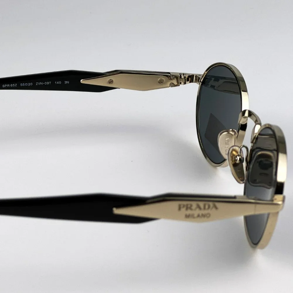 Prada PR65ZS ZVN09T Sunglasses Pale Gold Dark Grey Oval Metal Unisex